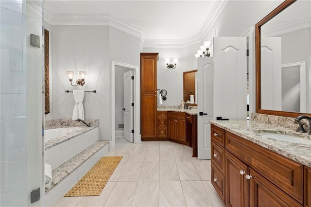 bathroom featuring ornamental molding, two vanities, a bath, and a sink