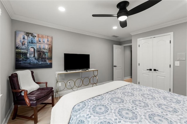 bedroom with baseboards, recessed lighting, wood finished floors, and ornamental molding