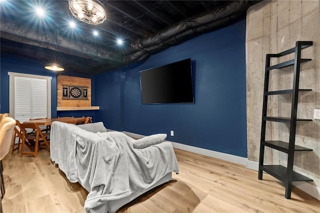 bedroom featuring baseboards and wood finished floors