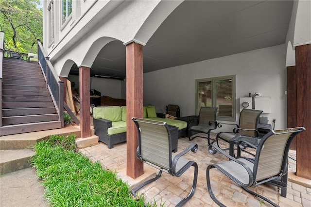 view of patio / terrace with stairway and outdoor lounge area