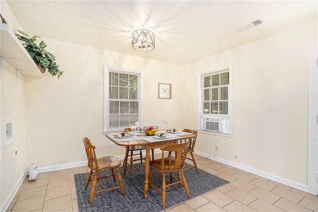 dining space with light tile patterned floors