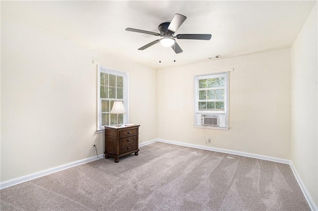 carpeted spare room with cooling unit and ceiling fan