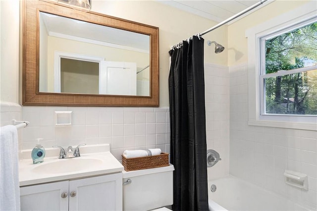 full bathroom featuring vanity, tile walls, shower / tub combo with curtain, and toilet