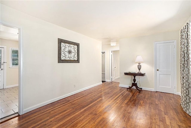 unfurnished room featuring dark hardwood / wood-style floors