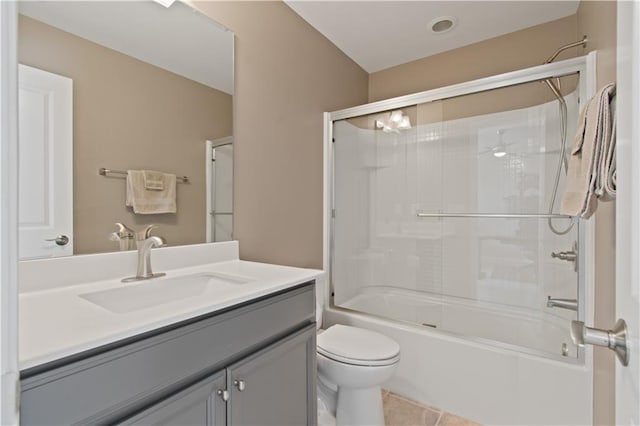 bathroom featuring tile patterned floors, vanity, toilet, and tub / shower combination