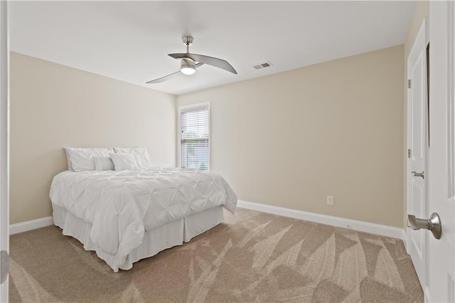 bedroom featuring baseboards, ceiling fan, light carpet, and visible vents