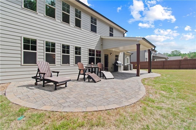 view of patio / terrace with central AC, fence, and area for grilling