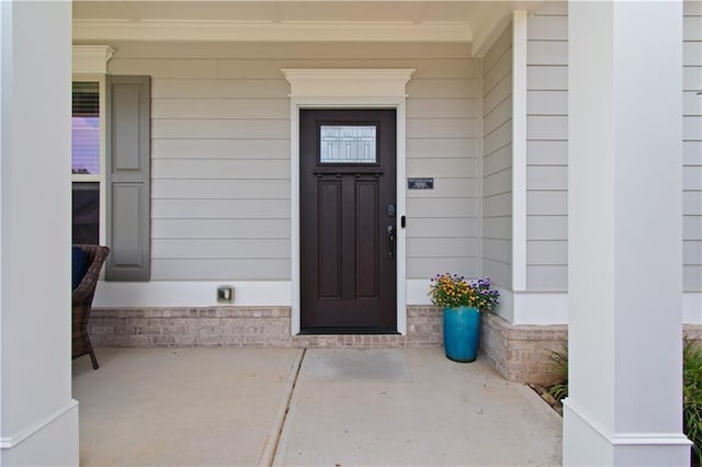 doorway to property featuring covered porch