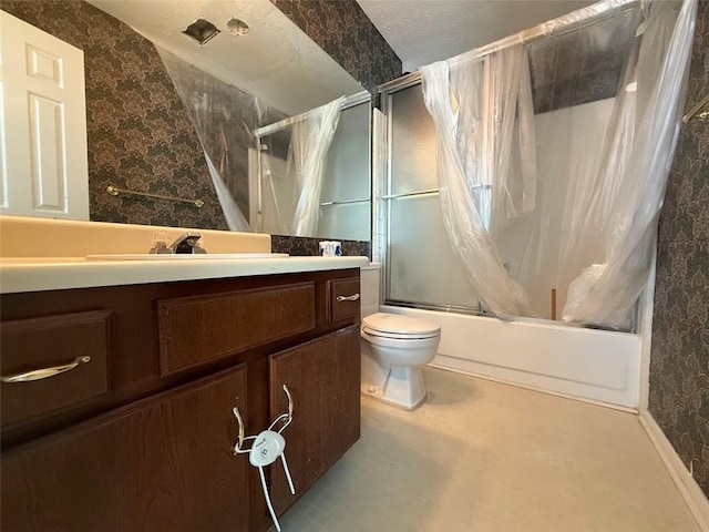 full bathroom with vanity, bath / shower combo with glass door, and toilet