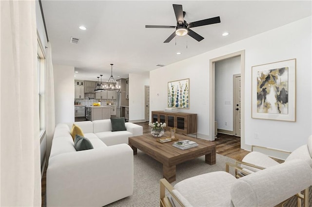 400 Stone Lea Trce, Oxford, GA 30054 - living room with a ceiling fan, a chandelier, recessed lighting, baseboards, and wood finished floors