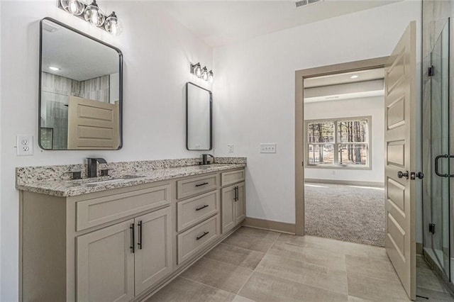 400 Stone Lea Trce, Oxford, GA 30054 - bathroom with a stall shower, double vanity, baseboards, and recessed lighting