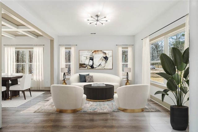 400 Stone Lea Trce, Oxford, GA 30054 - sitting room featuring hardwood / wood-style floors, a chandelier, baseboards, coffered ceiling, and beamed ceiling