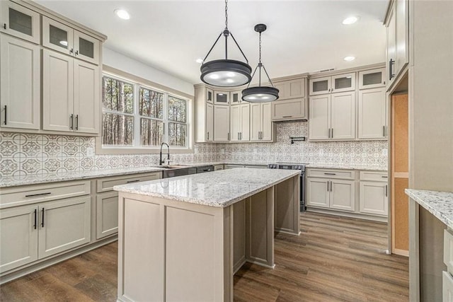 400 Stone Lea Trce, Oxford, GA 30054 - kitchen featuring stainless steel range with electric cooktop, dark wood-style flooring, a sink, backsplash, and a kitchen island