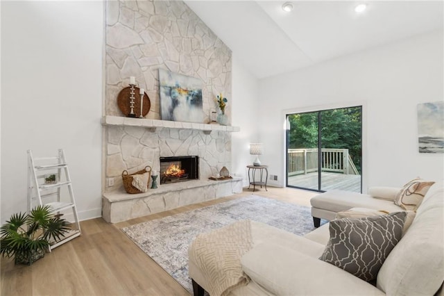 2010 Barnes Mill Rd, Marietta, GA 30062 - living area featuring wood finished floors, a fireplace, and high vaulted ceiling