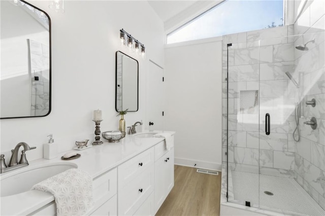 2010 Barnes Mill Rd, Marietta, GA 30062 - full bathroom with a stall shower, double vanity, and wood finished floors