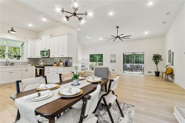 2010 Barnes Mill Rd, Marietta, GA 30062 - dining area with vaulted ceiling, a chandelier, light wood-style floors, recessed lighting, and ceiling fan