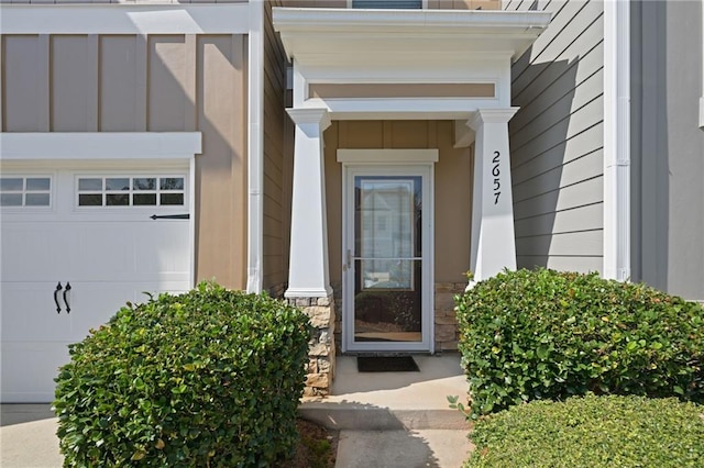 view of exterior entry featuring a garage