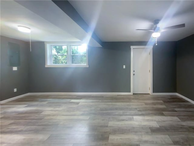 bonus room with electric panel, hardwood / wood-style flooring, and ceiling fan