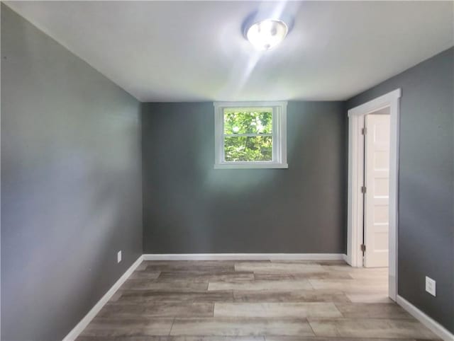 unfurnished room featuring light hardwood / wood-style flooring