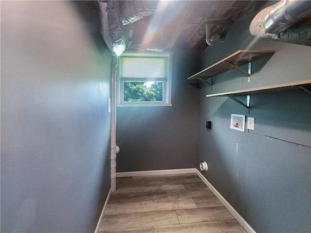 clothes washing area with hardwood / wood-style floors, hookup for a washing machine, and electric dryer hookup