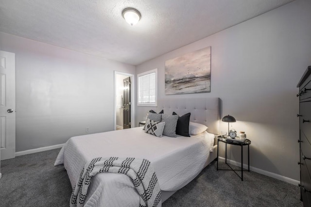 carpeted bedroom featuring baseboards