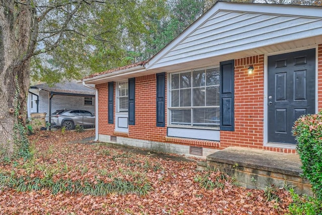 exterior space featuring crawl space and brick siding