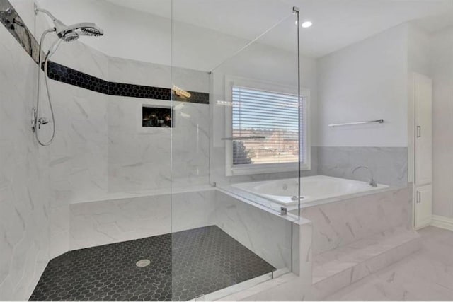 full bathroom featuring a marble finish shower, a garden tub, and marble finish floor