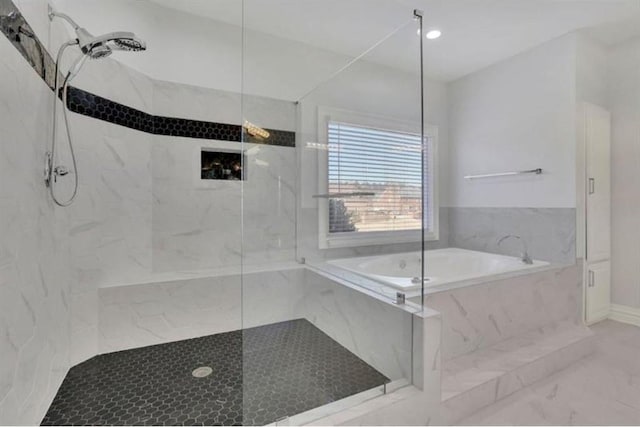 full bath featuring a marble finish shower, a bath, and marble finish floors