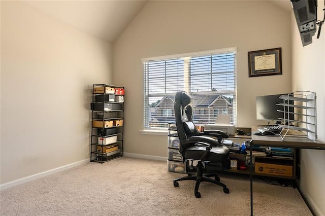 office area with lofted ceiling and light colored carpet