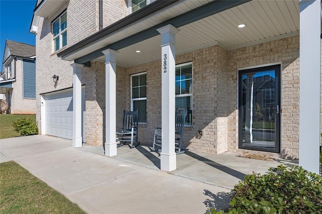 exterior space featuring a porch and a garage