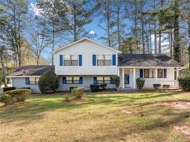 4347 Pleasant Ridge Rd, Decatur, GA 30034 - split level home featuring a front yard, covered porch, and brick siding