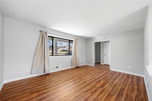 4347 Pleasant Ridge Rd, Decatur, GA 30034 - empty room featuring baseboards, wood finished floors, visible vents, and a textured ceiling