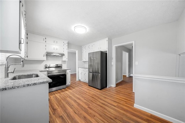 4347 Pleasant Ridge Rd, Decatur, GA 30034 - kitchen with tasteful backsplash, a sink, stainless steel appliances, white cabinetry, and under cabinet range hood