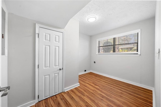 4347 Pleasant Ridge Rd, Decatur, GA 30034 - spare room with baseboards, wood finished floors, and a textured ceiling