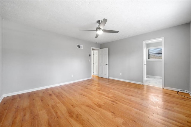 4347 Pleasant Ridge Rd, Decatur, GA 30034 - unfurnished bedroom featuring a textured ceiling, light wood-style floors, ceiling fan, baseboards, and visible vents