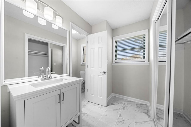 4347 Pleasant Ridge Rd, Decatur, GA 30034 - bathroom with marble finish floor, baseboards, toilet, and vanity