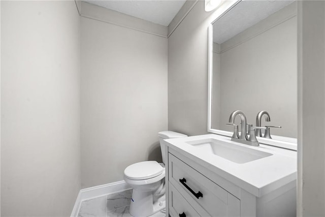 4347 Pleasant Ridge Rd, Decatur, GA 30034 - bathroom with baseboards, marble finish floor, vanity, and toilet