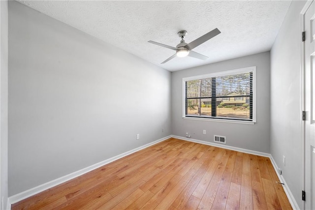 4347 Pleasant Ridge Rd, Decatur, GA 30034 - empty room with a ceiling fan, a textured ceiling, light wood finished floors, baseboards, and visible vents
