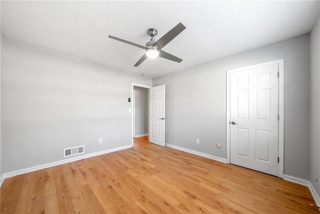 4347 Pleasant Ridge Rd, Decatur, GA 30034 - unfurnished bedroom featuring ceiling fan, baseboards, light wood finished floors, and visible vents