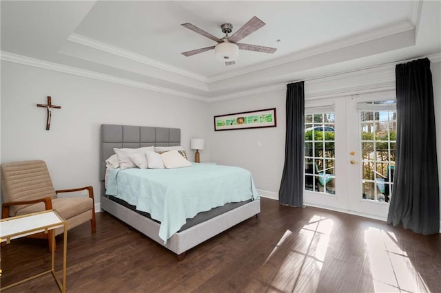 bedroom featuring a raised ceiling, ceiling fan, access to outside, and ornamental molding