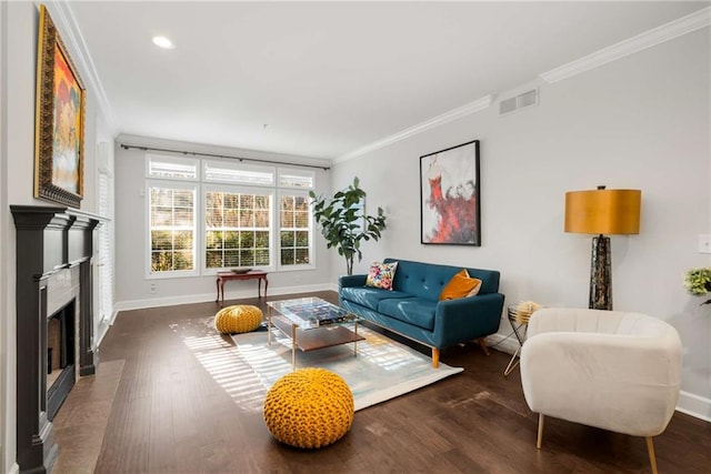 living room featuring dark wood-type flooring and ornamental molding