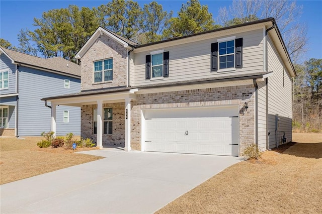 traditional home with an attached garage, driveway, and brick siding