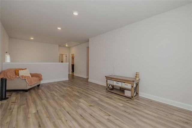 sitting room with recessed lighting, baseboards, and light wood finished floors