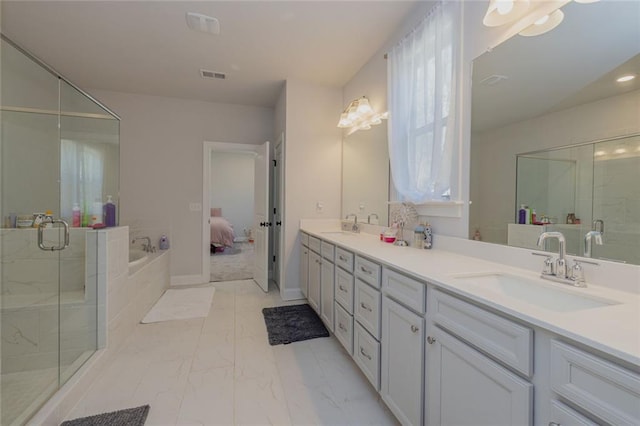 full bathroom with a sink, visible vents, marble finish floor, a shower stall, and double vanity