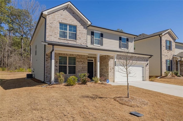 traditional-style home with driveway, brick siding, an attached garage, and cooling unit