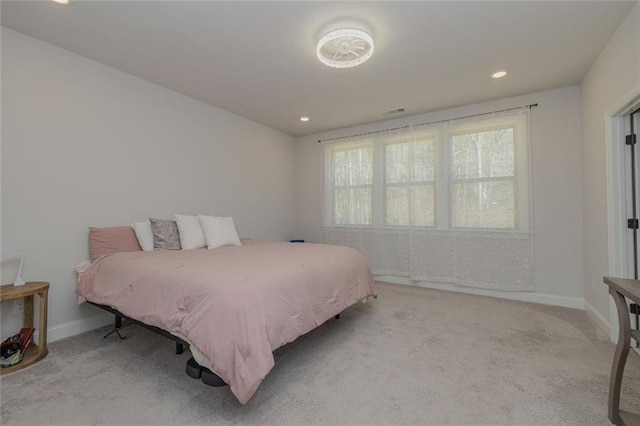 bedroom featuring recessed lighting, light colored carpet, visible vents, and baseboards