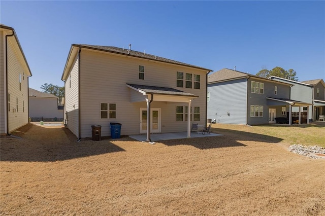 rear view of house featuring a patio