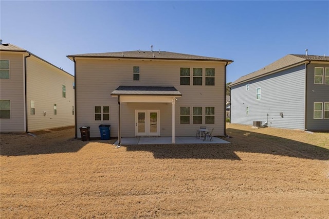 back of property featuring french doors and a patio