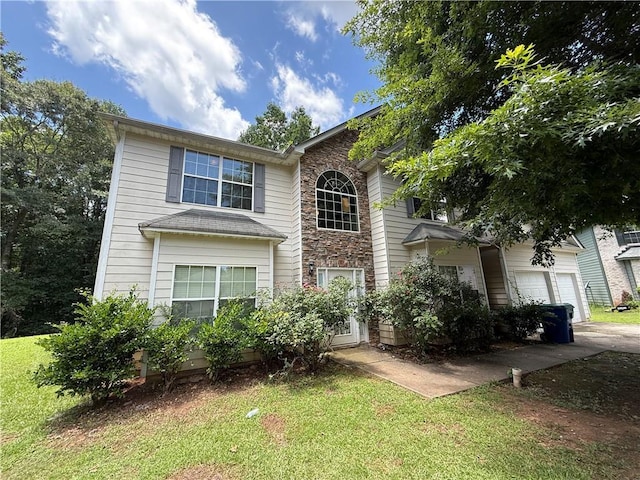 545 Platoro Ct SW, Atlanta, GA 30331 - traditional-style home featuring a front yard, stone siding, and driveway