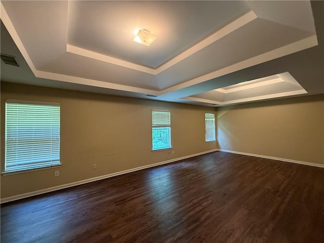 545 Platoro Ct SW, Atlanta, GA 30331 - empty room with a raised ceiling and dark wood-type flooring